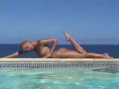 LibertyPorno presents: Blonde strips from bikini and takes a dip