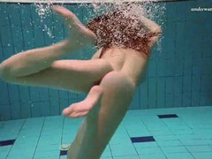 LibertyPorno presents: Underwater with a busty naked babe as she swims