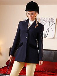 LibertyPorno presents: Clare R seductifvely removes her riding gear leaving on only opaque hold ups and sheer underwear