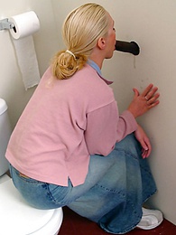 LibertyPorno presents: Blonde girl Jamie sits on the toilet and blows a black gloryhole dong